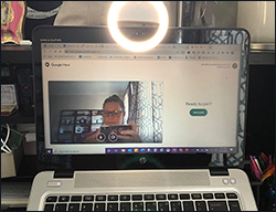 The battery-powered ring light clips to a phone, tablet or laptop.